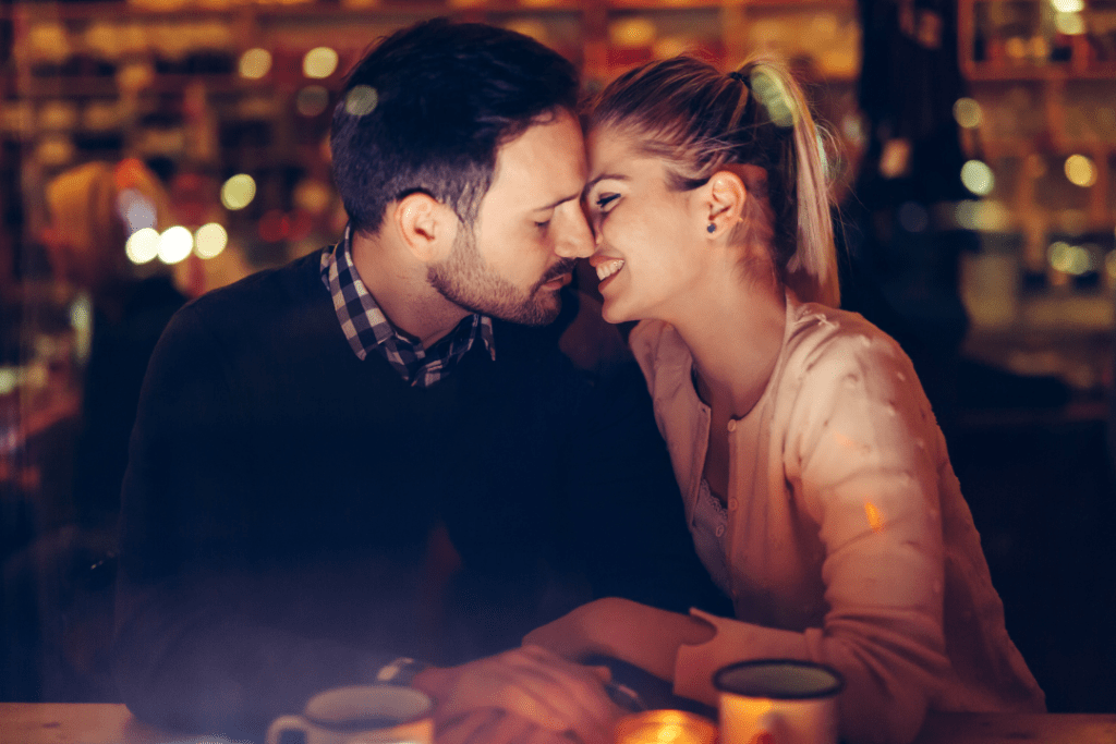 Photo of a couple kissing on a dinner date
