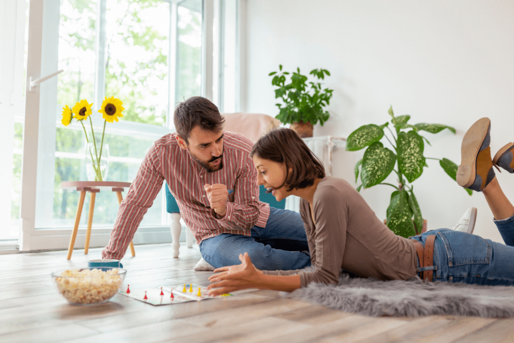 Couple playing a board game together