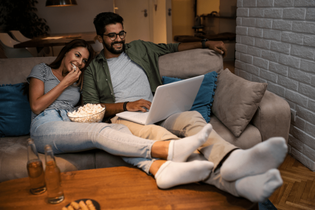 Couple watching a movie on a laptop